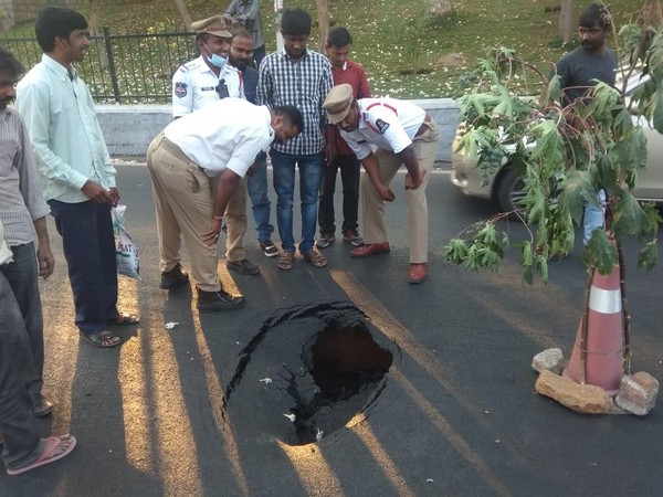 A portion of a busy road caved in near TRS Bhavan in Banjara Hills here on Monday