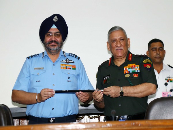 IAF Chief BS Dhanoa handing over the baton to the new Chairman, COSC, General Bipin Rawat in New Delhi on Friday (Picture Credit: Defence Ministry)