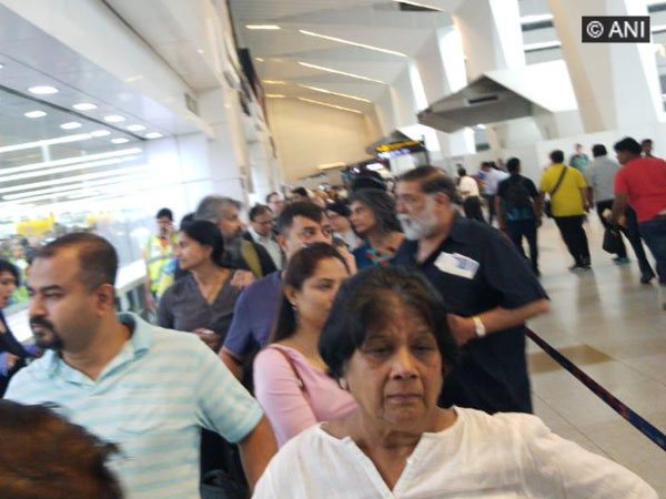 Passengers stranded at IGI Airport after immigration servers went downon Monday Pnoto/ANI