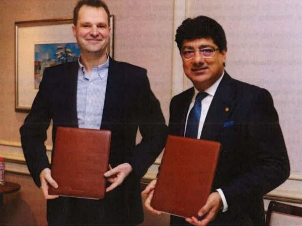 Craps (left) and Chhatwal after signing the agreement in Mumbai