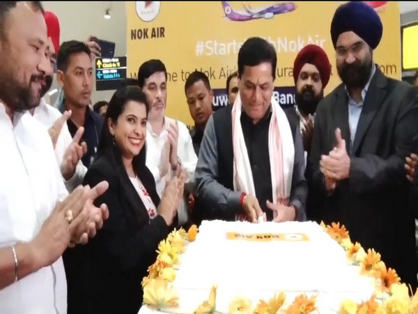 Assam Chief Minister Sarbananda Sonowal flags off the first flight to Bangkok at Lokapriya Gopinath Bordoloi International Airport. on Sunday. Photo/ANI