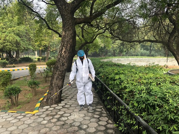 A zoo workers disinfecting the premises. (Photo/ANI)