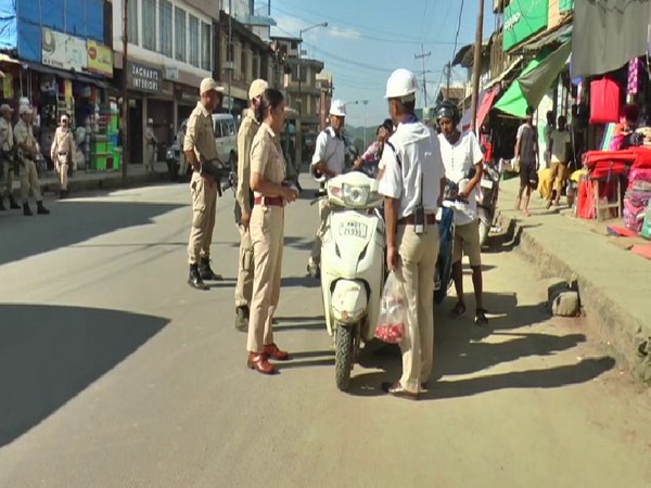 A visual of Manipur Police giving counseling to the people without helmets in Imphal on Sunday. Photo/ANI