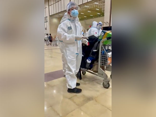 Chinese in PPE kits leaving from Karachi Airport