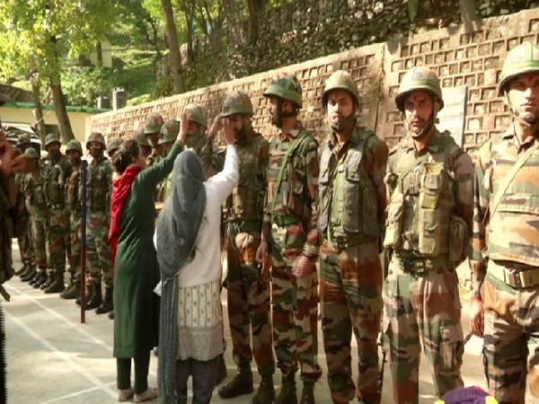 Women celebrating Bhai Dooj with Indian Army soldiers in Poonch on Saturday. (Photo/ANI) 