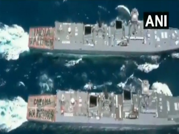 Indian Navy personnel raised their hats in honour of the coronavirus warriors and wrote 'India Salutes Corona Warriors' on the ship.