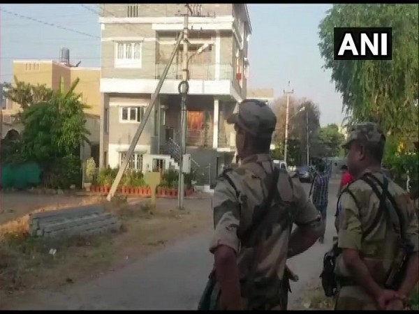I-T officials and CRPF personnel conducting raids at Karnataka Minor Irrigation Minister CS Puttaraju in Mandya on Thursday. Photo/ANI