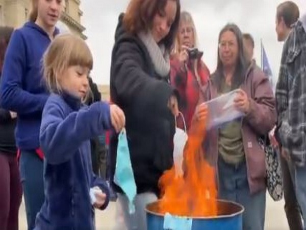 A video grab of protesters burning masks to protest against the COVID-19 safety guidelines in Idaho.