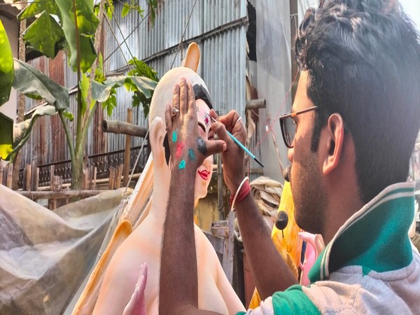 An idol maker designing Goddess Saraswat idol in Agartala on Wednesday (Photo/ANI)