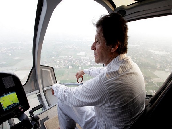 Imran Khan on his way to a campaign rally in a helicopter on July 12, 2018. (Photo credit: Reuters)