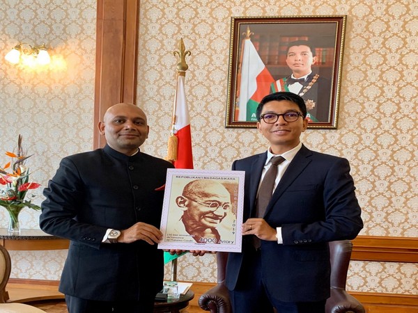 Indian Ambassador to Madagascar and President of Madagascar  unveil a postal stamp issued by the Madagascar Post to commemorate 150th birth anniversary of Mahatma Gandhi