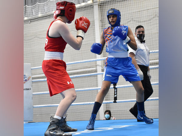 Indian pugilist Jasmine (in blue)