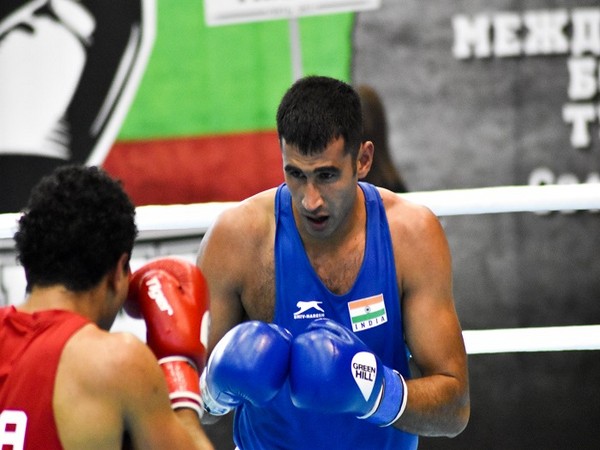 Indian boxer Naveen Kumar (in blue) in action during his first match at the 72nd Strandja Memorial Tournament