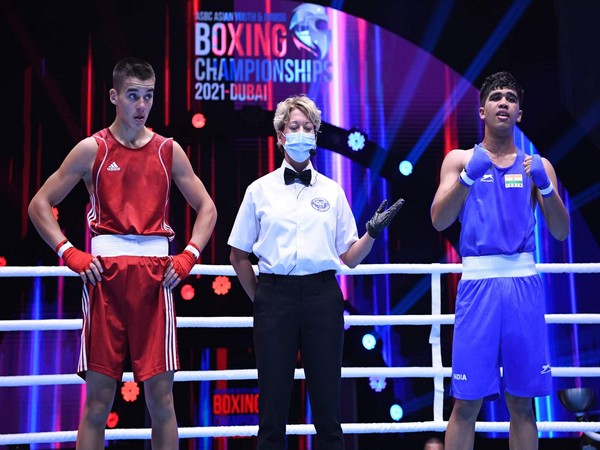 Gaurav Saini celebrates after winning bout (R)