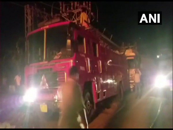 Firefighters at the site of the blaze in Indore