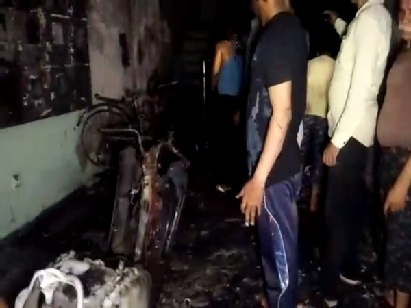 Vehicles charred in fire that broke out in a residential building in Indore on Thursday. Photo/ANI