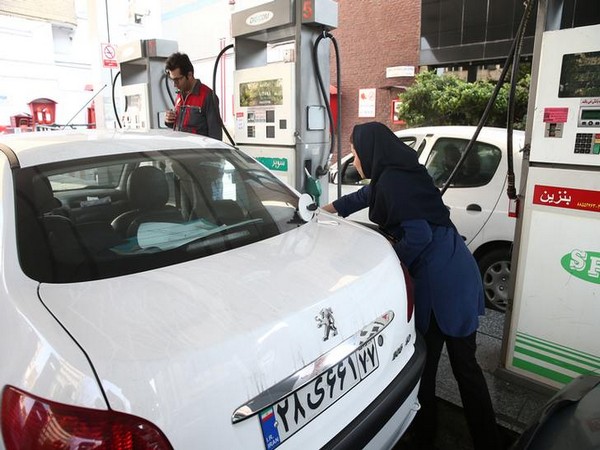 Iranians queued at petrol stations after fuel rationing and price hikes were announced on Friday
