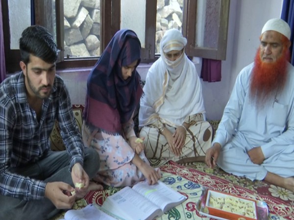 Aisha Bibi with her family. (Photo/ANI)