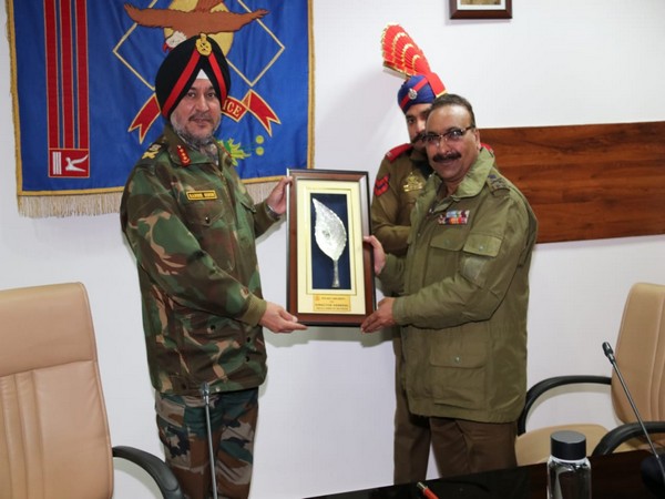 Director General of Police of Jammu Kashmir Police Dilbagh Singh Presenting momento to Lieutenant General Ranbir Singh in jammu on Tuesday Photo/ANI