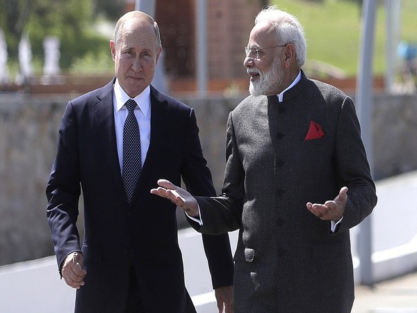 Russian President Vladimir Putin (L) and Prime Minister Narendra Modi (R) In Vladivostok on Wednesday