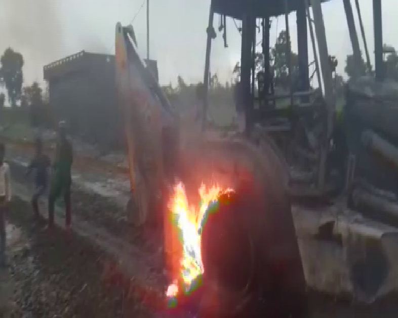 A JCB machine and a dumper truck were torched down by Naxalites in Gaya on Thursday evening. Photo/ANI