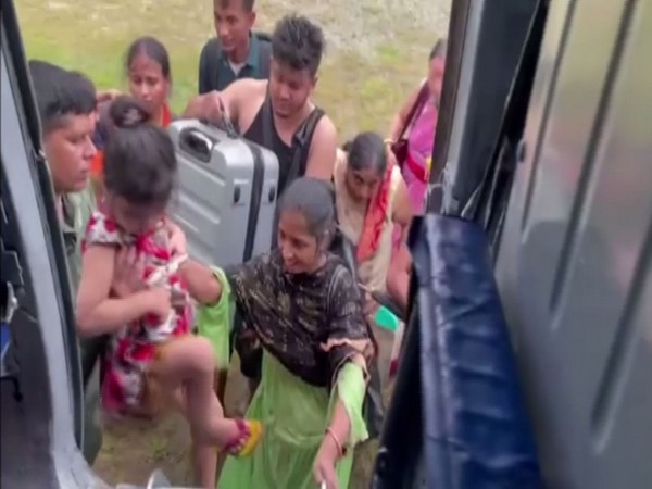 People being airlifted in a IAF plane in Assam's Dima Hasao. (ANI/photo)