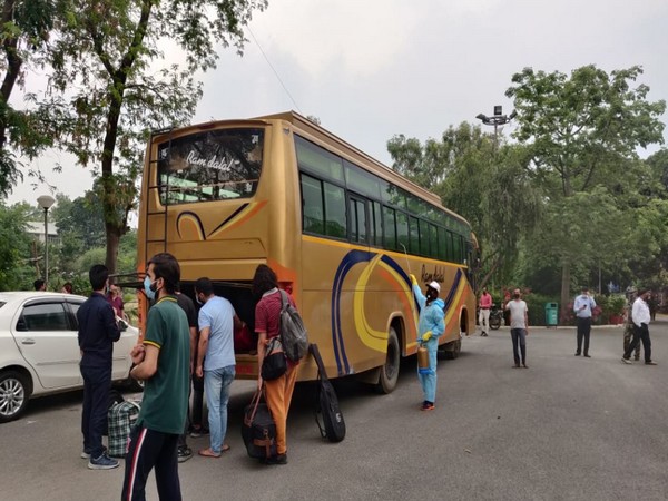 Jamia Millia Islamia University students boarding bus. Photo/ANI