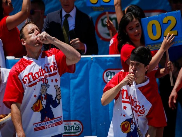 Joey Chestnut (Left) and Matt Stonie compete in Nathan's Famous Fourth of July International Hot Dog-Eating Contest