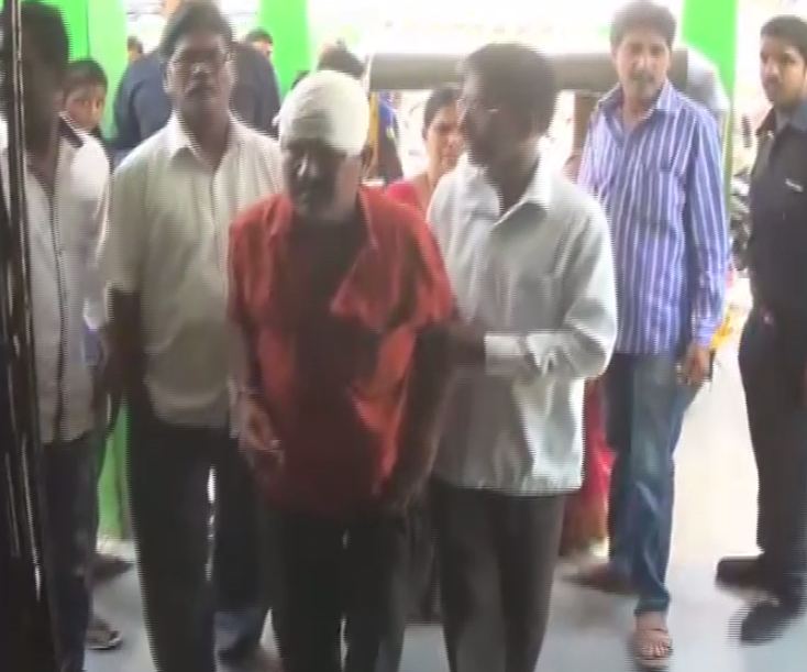 The victim of the attack (Red shirt)