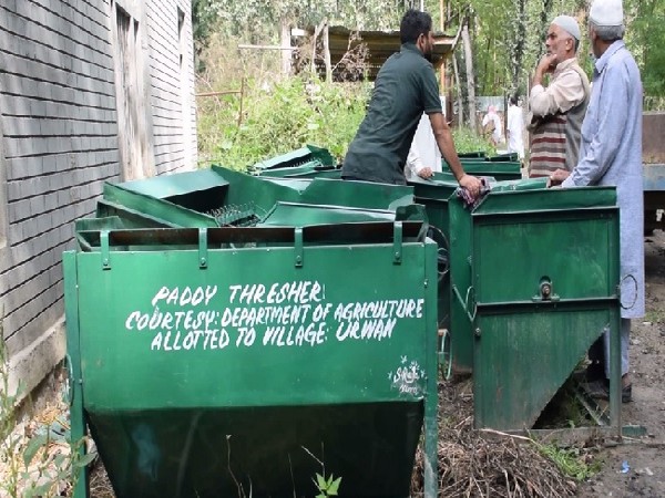 A visual of paddy thresher machines in Pulwama, Jammu and Kashmir. Photo/ANI 