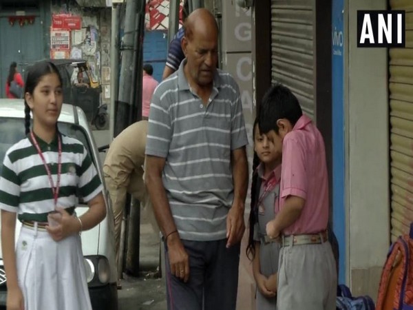 Children getting ready for school in Jammu on Saturday morning. Photo/ANI