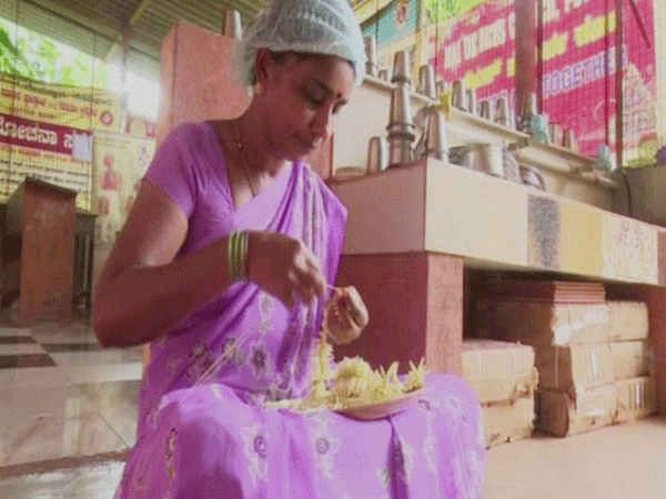 School staff member while making Jasmine garland and gajras. Photo/ANI