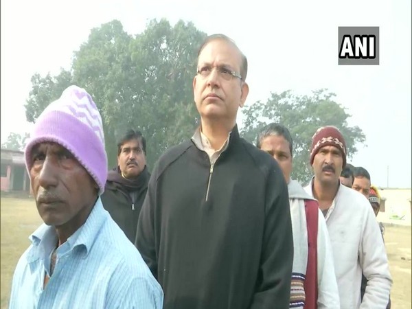 BJP MP Jayant Sinha standing in queue outside a polling booth in Hazaribagh on Thursday. Photo/ANI