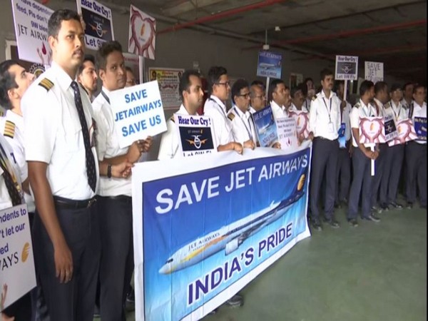 Jet Airways employees staging a silent protest at Mumbai International Airport on Wednesday. (Photo/ANI)