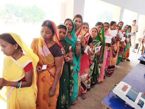 Women voters in queue at a polling station in Dumka, Jharkhand, on Sunday. Photo/ANI