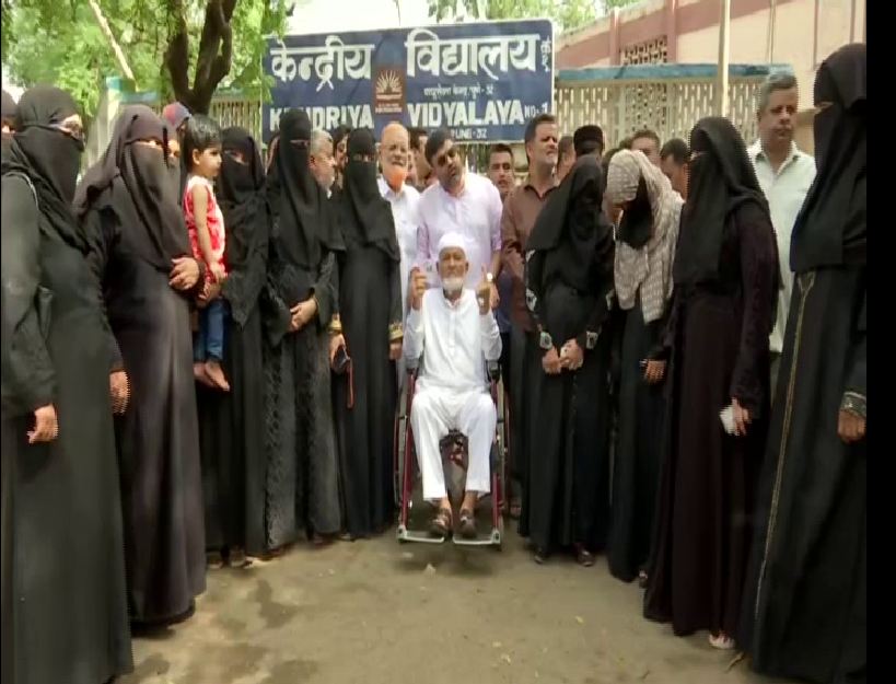 Haji Ibrahim Saleem Joad with his family members at a polling booth at Pune on Monday