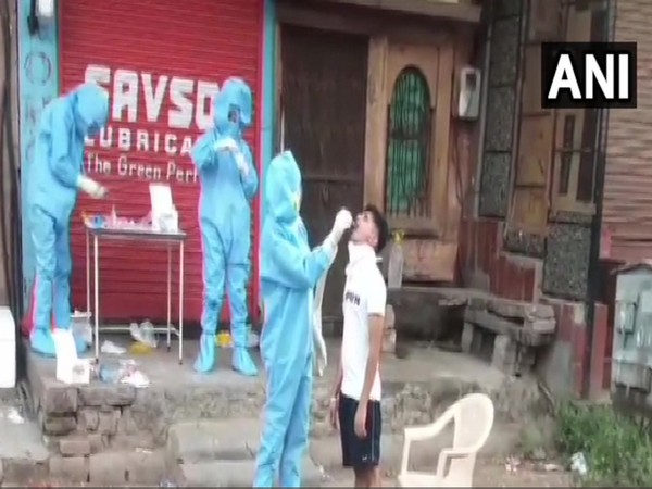 Sample being collected from a person in Jodhpur for COVID-19 testing. Photo/ANI