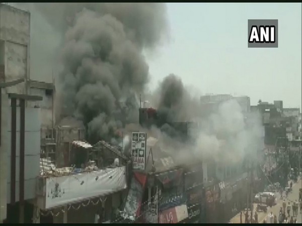 Fire breaks out at an electronic market at Johnston Ganj in Prayagraj on Thursday.