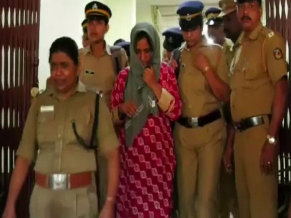 Accused Jolly Shaju with the police in Kozhikode on Friday. (Photo/ANI)