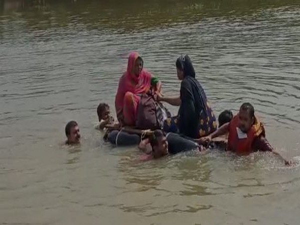 Pregnant woman uses makeshift boat to reach hospital in Darbhanga, Bihar. (Photo/ANI)