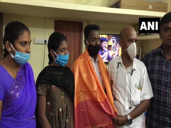 KC Mohan, the salon owner, being felicitated by locals in Madurai