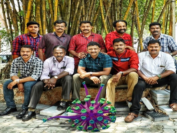 Social Media team of Kerala Police in front of Coronavirus model they used in an animation video.