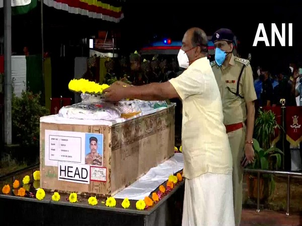 Kerala Finance Minister KN Balagopal pays tribue to Sepoy Vaisakh H in Thiruvananthapuram (Photo/ANI)