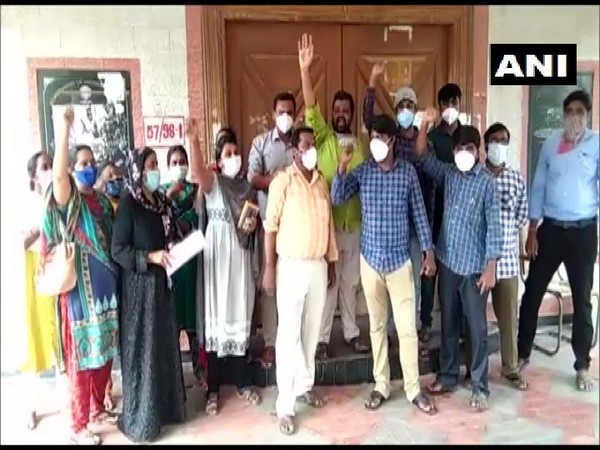 Contract lab technicians protest outside the DMHO office in Kadapa district, Andhra Pradesh on Sunday. (Photo/ANI)