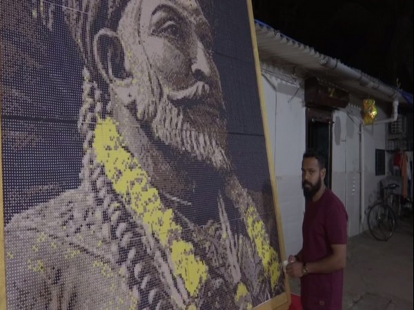 Nitin Dinesh Kamble created the 10X8 feet portrait in 10 days using 46,080 plastic bits of six different colours. Photo/ANI