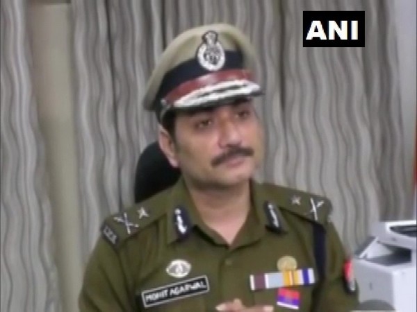 Inspector General Mohit Agarwal speaking to reporters in Kanpur on Monday.