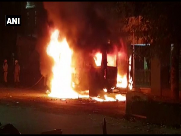 Relatives of a patient who died at the hospital allegedly set ablaze an ambulance of Belagavi Institute of Medical Sciences in Belgaum, Karnataka on Wednesday. (Photo/ANI)
