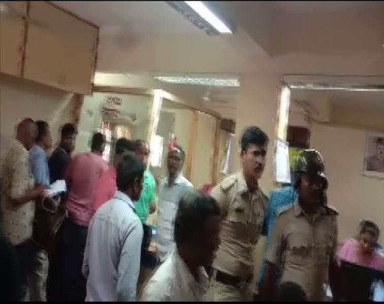 Farmers protest in front of a bank in Mandya, Karnataka