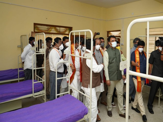 Visual of Karnataka Deputy Chief Minister Dr CN Ashwathnarayan at Covid Care centre with other officials (Photo/ANI)