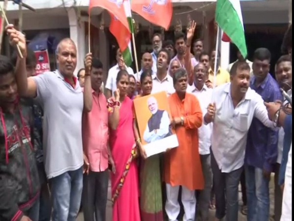 BJP leaders celebrating centre's move on Article 370 in Hyderabad on Monday. Photo/ANI
